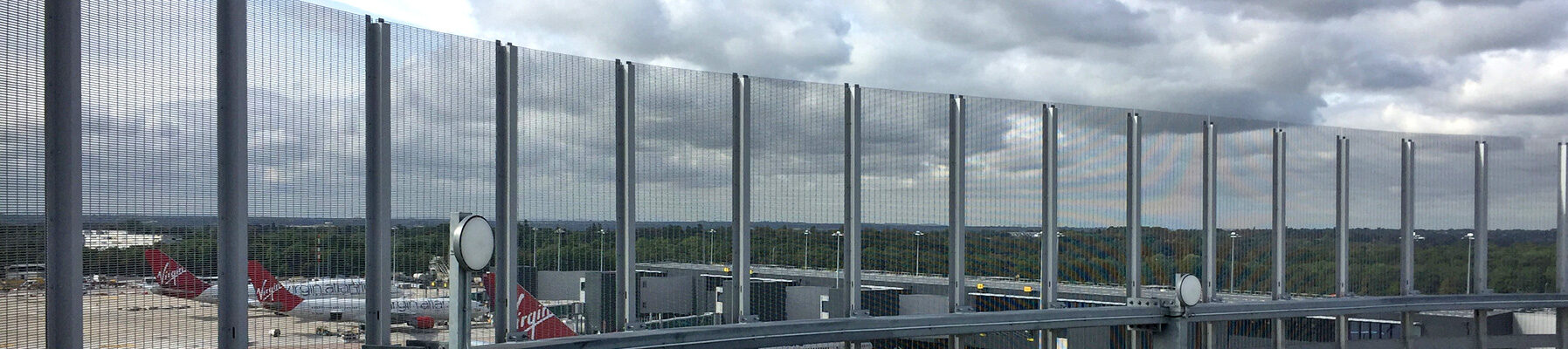 Stereo 3 steel grating scurity screen Mancester Airport banner2c