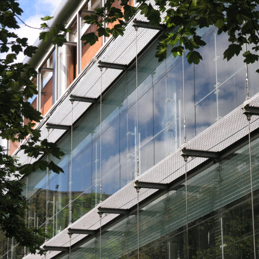 DemiMetro-33 open mesh grating panels Strathclyde University used as a brise soleil for solar screening and as service walkways on building south elevation