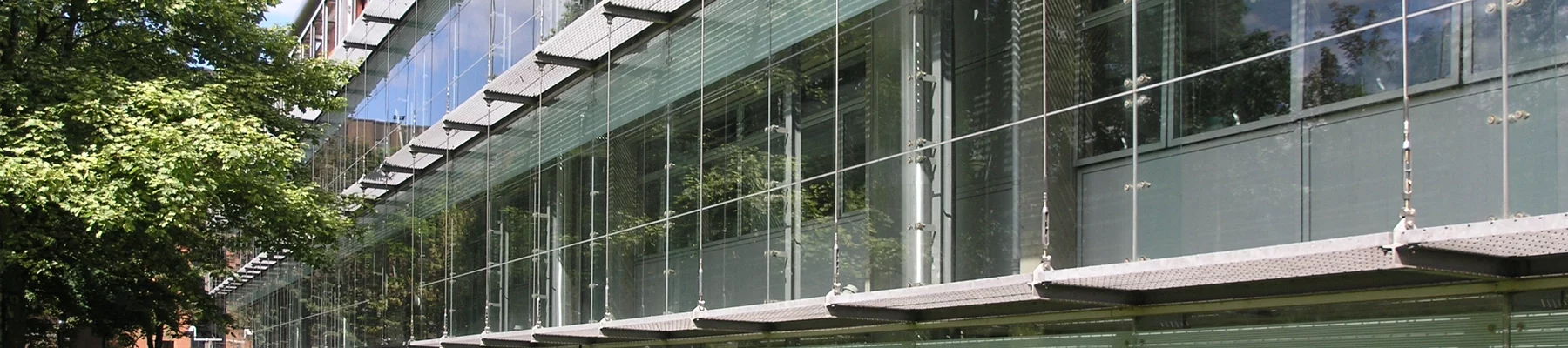 Strathclyde-University-brise-soleil-and-service-platforms open mesh grating panels on building facade providing brise soleil and service walkways at Strathclyde University